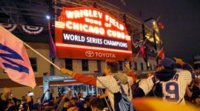 wrigley-field-marquee-chicago-cubs-fans-world-series-win-696x385.jpg