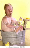 stock-photo-tiny-man-takes-a-bath-in-a-bucket-of-soapy-water-with-a-rubber-ducky-565774.jpg