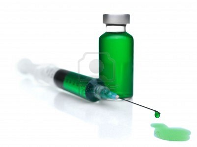6611412-close-up-of-a-syringe-and-a-vial-filled-with-green-liquid.jpg