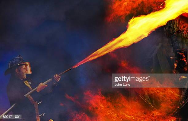 fireman-fighting-fire-with-fire-picture-id890471-001.jpg