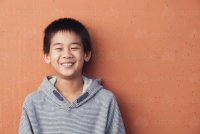 happy-young-asian-boy-austockphoto-000083158.jpg